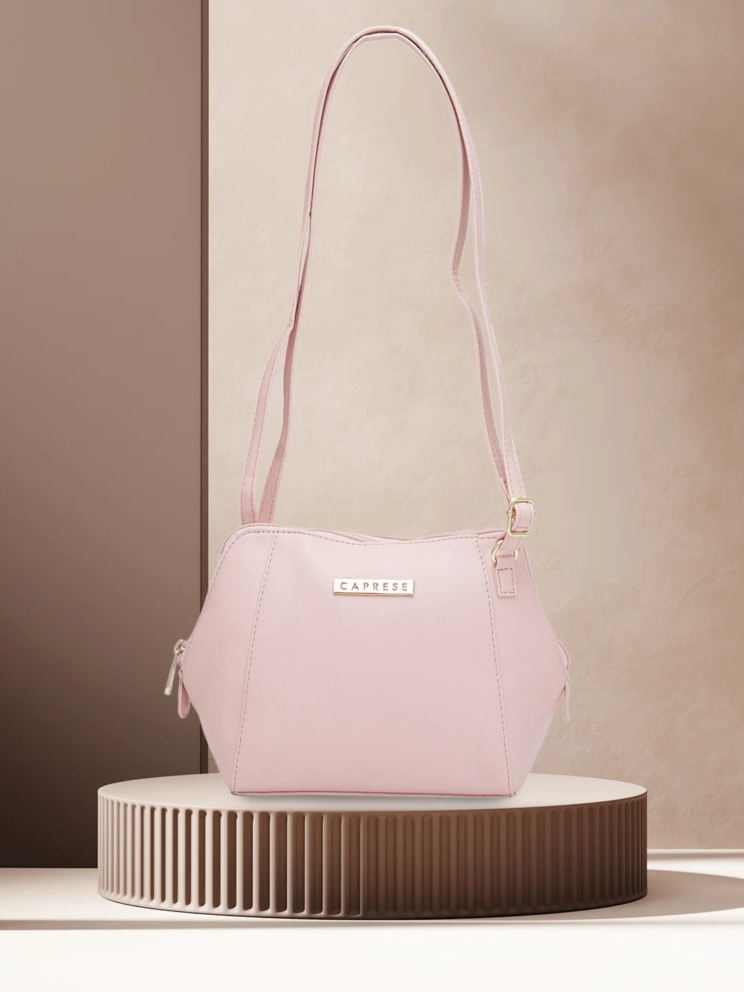 Caprese pink solid sling bag hotsell